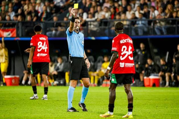 NIJMEGEN - Referee Francois Letexier shows a yellow card to Kevin Kers of NEC Nijmegen during the UEFA Champions League Play-offs match between NEC Nijmegen and FK Bodo Glimt at the Goffertstadion on 19 August 2026 in Nijmegen, the Netherlands. WART BRINKERHOF ANP xVIxANPxSportx xMarcelxterxBalsxIVx 565836928 originalFilename: 565836928.jpg