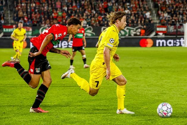 NIJMEGEN - Patrick Berg of FK Bodo Glimt (R) dribbles with the ball under pressure from Deveron Fonville of NEC Nijmegen during the UEFA Champions League Play-offs match between NEC Nijmegen and FK Bodo Glimt at the Goffertstadion on 19 August 2026 in Nijmegen, the Netherlands. WART BRINKERHOF ANP xVIxANPxSportx xMarcelxterxBalsxIVx 565837000 originalFilename: 565837000.jpg