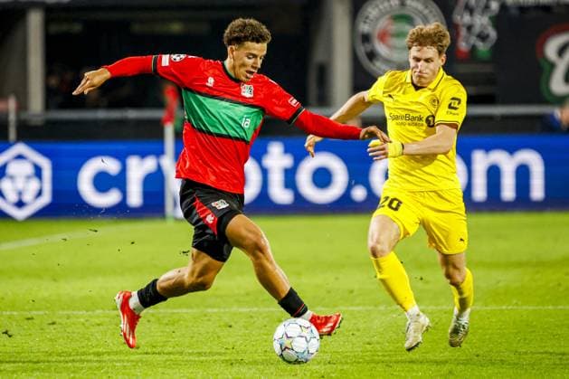 NIJMEGEN - Clement Bischoff of NEC Nijmegen battles for possession with Fredrik Sjovold of FK Bodo Glimt during the UEFA Champions League Play-offs match between NEC Nijmegen and FK Bodo Glimt at the Goffertstadion on 19 August 2026 in Nijmegen, the Netherlands. WART BRINKERHOF ANP xVIxANPxSportx xMarcelxterxBalsxIVx 565837050 originalFilename: 565837050.jpg