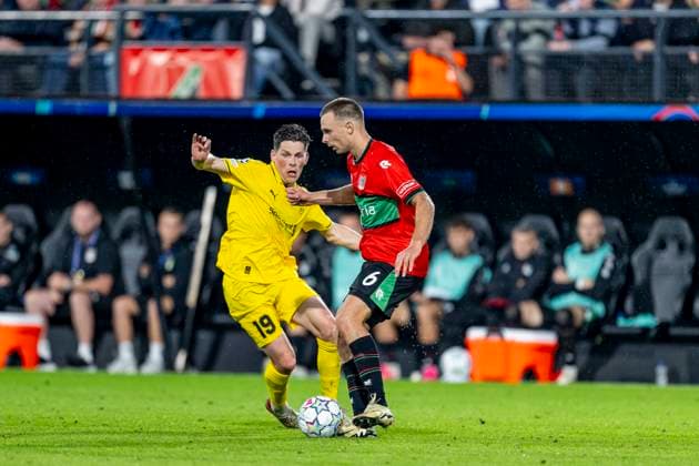 NIJMEGEN - L-R FC Bodo Glimt middenvelder Sondre Brunstad Fet en N.E.C. Nijmegen middenvelder Darko Nejasmic tijdens de UEFA Champions League wedstrijd tussen N.E.C. en FC Bodo Glimt in Gofferpark op 19 augustus 2026 in Nijmegen, Nederland. - *** NIJMEGEN: FC Bodo Glimt midfielder Sondre Brunstad Fet and NEC Nijmegen midfielder Darko Nejasmic during the UEFA Champions League match between NEC and FC Bodo Glimt at Gofferpark on August 19, 2026, in Nijmegen, the Netherlands