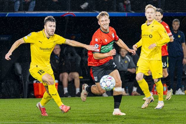 NIJMEGEN - Kaj Sierhuis of NEC Nijmegen battles for possession with Fredrik Andre Bjorkan of FK Bodo Glimt during the UEFA Champions League Play-offs match between NEC Nijmegen and FK Bodo Glimt at the Goffertstadion on 19 August 2026 in Nijmegen, the Netherlands. KEVIN SENDERS ANP xVIxANPxSportx xMarcelxterxBalsxIVx 565839387 originalFilename: 565839387.jpg