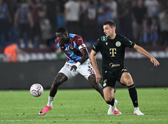 Trabzonspor v Ferencvaros - UEFA Europa League TRABZON, TURKIYE - AUGUST 20: Paul Onuachu (L) of Trabzonspor in action against Toon Raemaekers (R) Ferencvaros during the first leg of the UEFA Europa League play-off round between Trabzonspor and Ferencvaros at Papara Park in Trabzon, Turkiye, on August 20, 2026. Hakan Burak Altunoz Anadolu Trabzon Turkey. Editorial use only. Please get in touch for any other usage.  Copyright: x2026xAnadoluxHakanxBurakxAltunozx