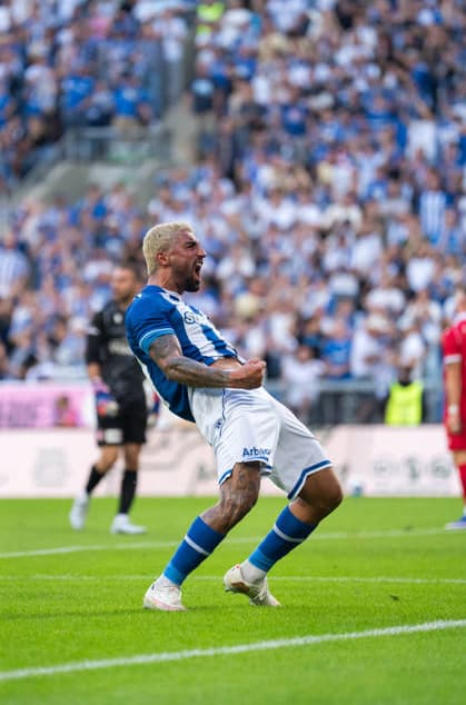 Allahyar Sayyadmanesh of KKS Lech Poznan celebrates after scoring the second goal during UEFA Europa League - Playoff Round season 26 27 match between teams of KKS Lech Poznan and FC Thun (Ruslan Taran Ball Raw Images) Poznan Enea Stadium Poland Copyright: xRuslanxTaranx RUS_LECH-THUN-0040