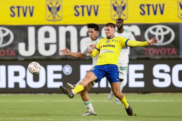 Omonoia s Panagiotis Andreou and STVV s Ryan Merlen fight for the ball during a soccer game between Belgian Sint-Truidense V.V. and Cypriot AC Omonoia Nicosia, Thursday 20 August 2026 in Sint-Truiden, the first leg of the play-off round for the UEFA Europa League league phase. BRUNOxFAHY  x183847984x