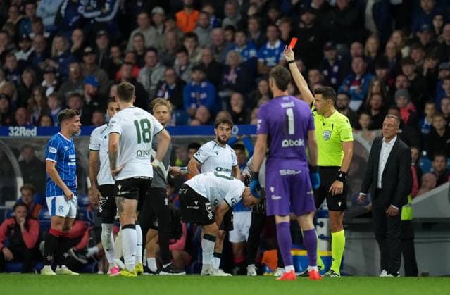 Referee Marian Barbu shows a straight red card to Cameron Devlin of Rangers for a challenge on Jiri Slama of FK Jablonec, following a VAR review. Rangers v Jablonec, UEFA Conference League, Play-Off Round, First Leg, Football, Ibrox Stadium, Glasgow, Scotland, UK - 20 Aug 2026Glasgow Ibrox Stadium Scotland United Kingdom  Copyright: xStuartxWallace Shutterstockx 17108686bv