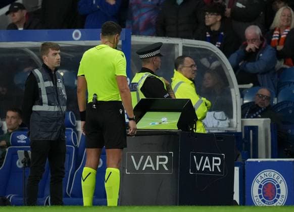 Referee Marian Barbu reviews footage on the VAR monitor before showing a straight red card to Cameron Devlin of Rangers for a challenge on Jiri Slama of FK Jablonec. Rangers v Jablonec, UEFA Conference League, Play-Off Round, First Leg, Football, Ibrox Stadium, Glasgow, Scotland, UK - 20 Aug 2026Glasgow Ibrox Stadium Scotland United Kingdom  Copyright: xStuartxWallace Shutterstockx 17108686bw