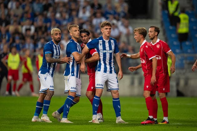 Wojciech Monka, Mateusz Skrzypczak and Allahyar Sayyadmanesh of KKS Lech Poznan fights for the ball before corner kick during UEFA Europa League - Playoff Round season 26 27 match between teams of KKS Lech Poznan and FC Thun (Ruslan Taran Ball Raw Images) Poznan Enea Stadium Poland Copyright: xRuslanxTaranx _IMG7459