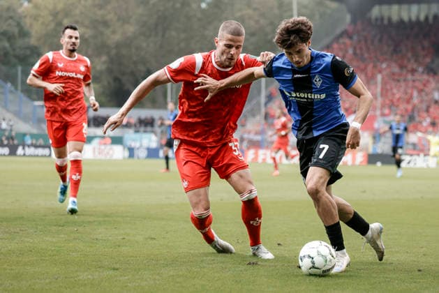 21.08.2026, xhettx, Fussball DFB Pokal 1.Runde, SV Waldhof Mannheim - 1.FC Kaiserslautern v.l. Jan Elvedi (1. FC Kaiserslautern, 33) und Lovis Bierschenk (SV Waldhof Mannheim, 7) im Zweikampf (DFL DFB REGULATIONS PROHIBIT ANY USE OF PHOTOGRAPHS as IMAGE SEQUENCES and or QUASI-VIDEO) *** August 21, 2026, xhettx, Soccer DFB Cup 1st Round, SV Waldhof Mannheim 1 FC Kaiserslautern v l Jan Elvedi 1 FC Kaiserslautern, 33 and Lovis Bierschenk, SV Waldhof Mannheim, 7 in a tackle. DFL and DFB regulations prohibit any use of photographs as image sequences and or quasi-video.