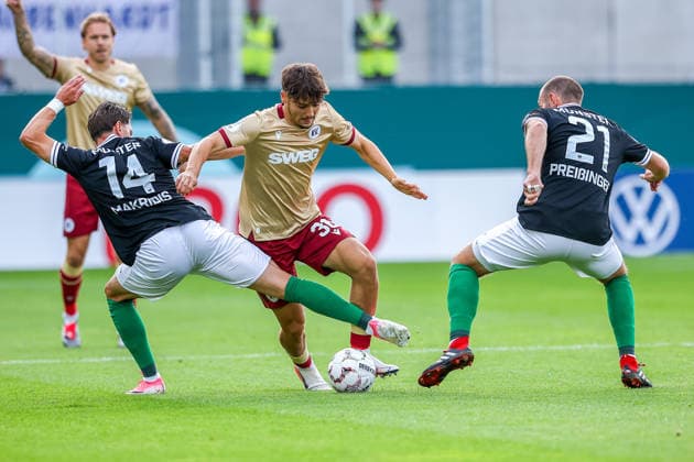 2026.08.21, xkwix, Fußball, DFB-Pokal, Preußen Münster - Karlsruher SC, LVM-Preußenstadion, 1.Runde, Saison 2026 2027: Rafael Pinto Pedrosa (Karlsruher SC 36) im Zweikampf gegen Charalambos Makridis (Preussen Muenster 14) und Rico Preissinger (Preussen Muenster 21) DFB regulations prohibit any use of photographs as image sequences and or quasi-video. Photo: xKamilxWilkowskixPressefotoKochx Nordrhein-Westfalen Deutschland *** August 21, 2026, xkwix, Soccer, DFB Cup, Preußen Münster vs. Karlsruher SC, LVM Preußenstadion, Round 1, 2026–2027 Season: Rafael Pinto Pedrosa (Karlsruher SC, No. 36) in a tackle against Charalambos Makridis (Preußen Münster, No. 14) and Rico Preissinger (Preußen Münster, No. 21). DFB regulations prohibit any use of photographs as image sequences and or quasi-video. Photo: xKamilxWilkowskixPressefotoKochx North Rhine-Westphalia, Germany