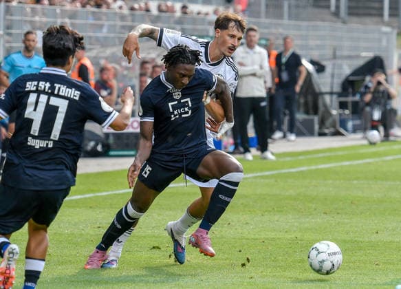 v. li. im Zweikampf Farid Omorou (St. Tönis 15) Robin Koch (Eintracht Frankfurt 4) 21.08.2026 ¢ Fussball ¢ SC St. Tönis vs Eintracht Frankfurt, Grotenburg-Stadion, Krefeld, DFB DFL REGULATIONS PROHIBIT ANY USE OF PHOTOGRAPHS AS IMAGE SEQUENCES AND OR QUASI-VIDEO NRW Germany *** From left in a one-on-one: Farid Omorou, St. Tönis 15; Robin Koch, Eintracht Frankfurt 4; August 21, 2026 ¢ Soccer ¢ SC St. Tönis vs. Eintracht Frankfurt, Grotenburg Stadium, Krefeld, DFB DFL REGULATIONS PROHIBIT ANY USE OF PHOTOGRAPHS AS IMAGE SEQUENCES AND OR QUASI-VIDEO NRW Germany Copyright: xpepphotox xSaschaxWeizx pep00321, pep_20260821_hm