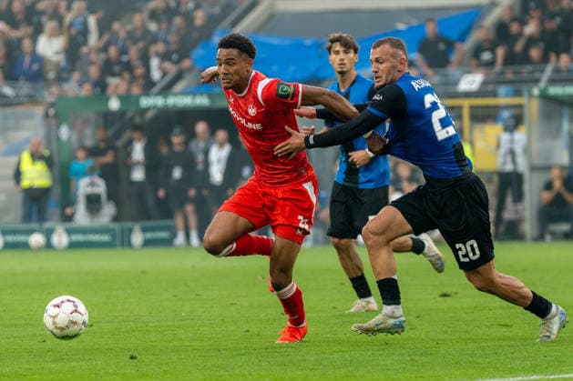 DFB-Pokal: SV Waldhof Mannheim vs 1. FC Kaiserslautern, 21.08.2026 Zweikampf zwischen Thierry Fidjeu-Tazemeta (1. FC Kaiserslautern, 39) und Kushtrim Asallari (SV Waldhof Mannheim, 20) DFB-Pokal: SV Waldhof Mannheim vs 1. FC Kaiserslautern, Carl-Benz-Stadion, 21.08.2026 DFB DFL REGULATIONS PROHIBIT ANY USE OF PHOTOGRAPHS AS IMAGE SEQUENCES AND OR QUASI-VIDEO. *** DFB Cup: SV Waldhof Mannheim vs. 1 FC Kaiserslautern, August 21, 2026: A tackle between Thierry Fidjeu Tazemeta of 1 FC Kaiserslautern (No. 39) and Kushtrim Asallari of SV Waldhof Mannheim (No. 20) in the DFB Cup match between SV Waldhof Mannheim and 1 FC Kaiserslautern at Carl Benz Stadium, August 21, 2026 DFB and DFL regulations prohibit any use of photographs as image sequences and or quasi-video. Copyright: xBEAUTIFULxSPORTS Hillx