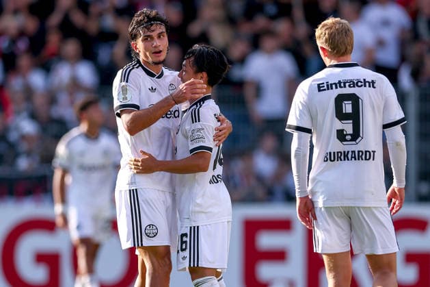21.08.2026, Fußball, SC St. Tönis - Eintracht Frankfurt, 1. Runde DFB-Pokal 2026 27, Grotenburg-Stadion in Krefeld, Saison 2026 2027: Torjubel nach dem Tor zum 5:0 durch Torschütze Can Uzun (Eintracht Frankfurt 42) zusammen mit Keita Kosugi (Eintracht Frankfurt 26) Jonathan Burkardt (Eintracht Frankfurt 09) DFB regulations prohibit any use of photographs as image sequences and or quasi-video. Nordrhein-Westfalen Deutschland *** August 21, 2026, Soccer, SC St. Tönis vs. Eintracht Frankfurt, First Round of the 2026–27 DFB Cup, Grotenburg Stadium in Krefeld, 2026–2027 season: Goal celebration after the 5–0 goal by Can Uzun (No. 42, Eintracht Frankfurt), along with Keita Kosugi (No. 26, Eintracht Frankfurt) and Jonathan Burkardt (No. 09, Eintracht Frankfurt). DFB regulations prohibit any use of photographs as image sequences and or quasi-video. North Rhine-Westphalia Germany