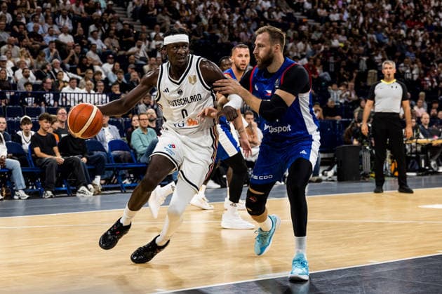 HAMBURG, GERMANY - AUGUST 21: Isaac Bonga (Germany, 0) controls the ball against Martin Kriz (Czechia, 31) during a Turkish Airlines Basketball Supercup match between Germany vs. Czechia at Barclays Arena on August 21, 2026 in Hamburg, Germany. Hamburg Germany Copyright: xSteffiexWunderlx