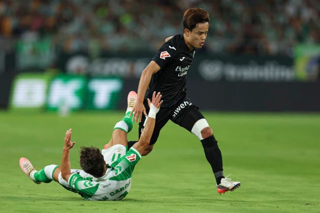 ESP: Real Betis - Real Sociedad. La Liga EA Sports. Matchday 2. Takefusa Kubo of Real Sociedad and Fran Garcia of Real Betis during the La Liga EA Sports match between Real Betis and Real Sociedad played at La Cartuja Stadium on Aug 21, 2026 in Sevilla, Spain. kpng Copyright: xAntonioxPozox xPRESSINPHOTOx AP_2627_BET_RSO_008