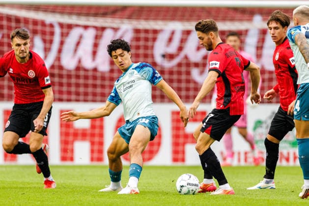 WIESBADEN, GERMANY - AUGUST 22: Ibrahim Maza (Bayer 04 Leverkusen, 30) is challenged by Lukas Schleimer (SV Wehen Wiesbaden, 7) during the first-round match between SV Wehen Wiesbaden vs. Bayer 04 Leverkusen at Brita Arena of the German Cup on August 22, 2026 in Wiesbaden, Germany. DFL REGULATIONS PROHIBIT ANY USE OF PHOTOGRAPHS AS IMAGE SEQUENCES AND OR QUASI-VIDEO. Hessen Germany Copyright: xStephanxHahnex