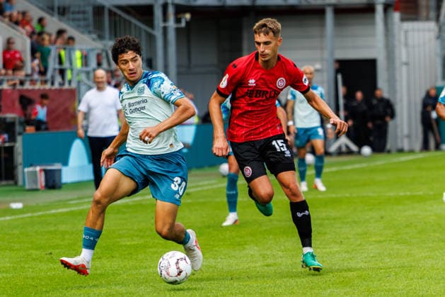 WIESBADEN, GERMANY - AUGUST 22: Ibrahim Maza (Bayer 04 Leverkusen, 30) and Justin Janitzek (SV Wehen Wiesbaden, 15) compete for the ball during the first-round match between SV Wehen Wiesbaden vs. Bayer 04 Leverkusen at Brita Arena of the German Cup on August 22, 2026 in Wiesbaden, Germany. DFL REGULATIONS PROHIBIT ANY USE OF PHOTOGRAPHS AS IMAGE SEQUENCES AND OR QUASI-VIDEO. Hessen Germany Copyright: xStephanxHahnex