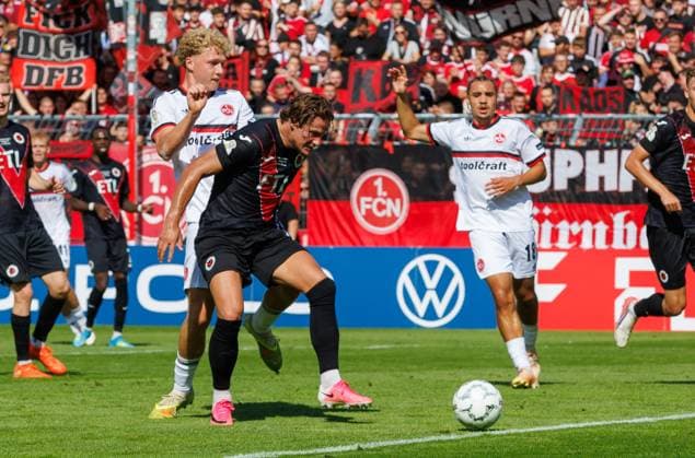 22.08.2026 - Fussball - Saison 2026 2027 - DFB Pokal Vereinspokal - 01. Runde: Viktoria Köln - 1. FC Nürnberg Nuernberg FCN ( Club ) - Sportfoto Zink DaMa - xdaxmax - regulations prohibit any use of photographs as image sequences and or quasi-video - Piet Scobel (19, 1. FC Nürnberg FCN ) Tobias Eisenhuth (6, FC Viktoria Köln ) *** August 22, 2026 Soccer Season 2026–2027 DFB Cup Club Cup First Round Viktoria Köln 1 FC Nürnberg Nuremberg FCN Club Sports Photo Zink DaMa xdaxmax regulations prohibit any use of photographs as image sequences and or quasi-video Piet Scobel 19, 1. FC Nürnberg (FCN) Tobias Eisenhuth 6, FC Viktoria Cologne