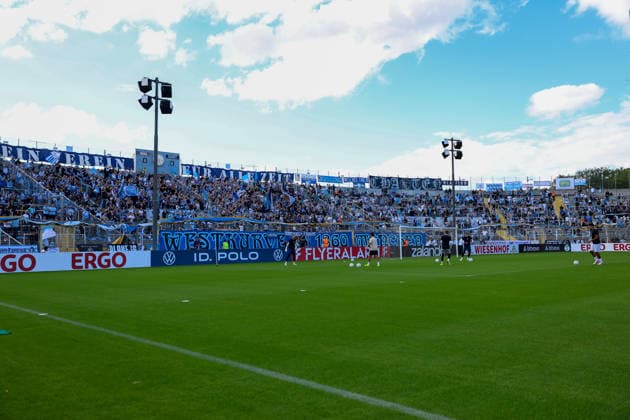 Fankurve der Fans vom TSV 1860 Muenchen, GER, TSV 1860 Muenchen vs. Holstein Kiel, Fussball, DFB-Pokal, 1. Runde, Saison 2026 2027, 22.08.2026, DFL REGULATIONS PROHIBIT ANY USE OF PHOTOGRAPHS AS IMAGE SEQUENCES, GER, TSV 1860 Muenchen vs. Holstein Kiel, Fussball, DFB-Pokal, 1. Runde, Saison 2026 2027, 22.08.2026 Muenchen *** TSV 1860 Munich fan section, GER, TSV 1860 Munich vs. Holstein Kiel, soccer, DFB Cup, 1st round, 2026–2027 season, August 22, 2026, DFL regulations prohibit any use of photographs as image sequences, GER, TSV 1860 Munich vs. Holstein Kiel, soccer, DFB Cup, 1st round, 2026–2027 season, August 22, 2026, Munich Copyright: xEibner-Pressefoto JennixMaulx EP_JML
