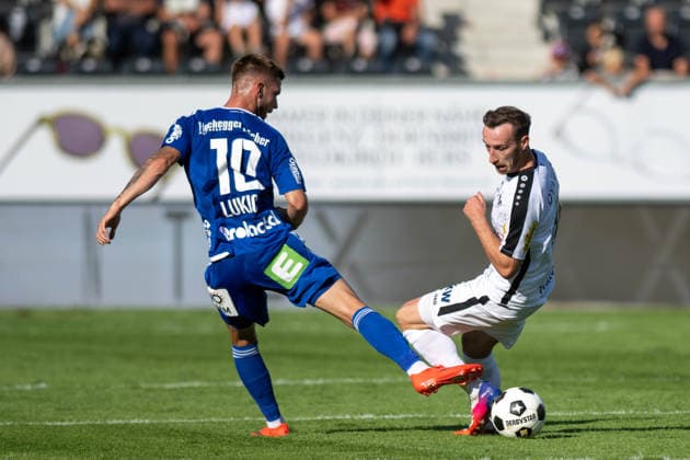 SOCCER - BL, Altach vs Hartberg ALTACH,AUSTRIA,22.AUG.26 - SOCCER - ADMIRAL Bundesliga, SCR Altach vs TSV Hartberg. Image shows Oliver Lukic (Hartberg) and Mike Baehre (Altach).  GEPAxpictures xOliverxLerch