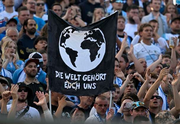 22.08.2026, Fussball DFB-Pokal 2026 27, 1.Runde, TSV 1860 München - Holstein Kiel, im Stadion an der Grünwalderstrasse in München, Die Welt gehört euch uns ***DFL and DFB regulations prohibit any use of photographs as image sequences and or quasi-video.*** *** August 22, 2026, 2026–27 DFB Cup, 1st Round, TSV 1860 Munich vs. Holstein Kiel, at the stadium on Grünwalderstrasse in Munich, The world belongs to you and us ***DFL and DFB regulations prohibit any use of photographs as image sequences and or quasi-video***