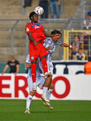 22.08.2026, Fussball DFB-Pokal 2026 27, 1.Runde, TSV 1860 München - Holstein Kiel, im Stadion an der Grünwalderstrasse in München, Faride Alidou (Holstein Kiel) setzt sicg durch, ***DFL and DFB regulations prohibit any use of photographs as image sequences and or quasi-video.*** *** August 22, 2026, Soccer: 2026-27 DFB Cup, First Round, TSV 1860 Munich vs. Holstein Kiel, at the Stadion an der Grünwalderstrasse in Munich, Faride Alidou; Holstein Kiel prevails, ***DFL and DFB regulations prohibit any use of photographs as image sequences and or quasi-video***