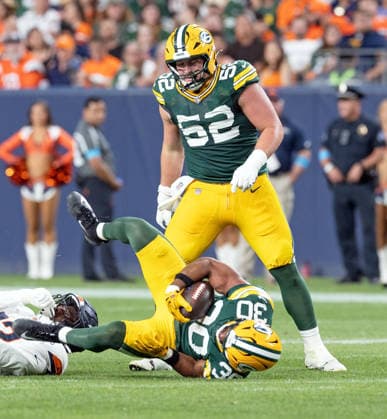 August 22, 2026, Denver, Colorado, USA: Packers RB CHRIS BROOKS gets dumped to the ground by a Broncos defender during the 2nd. Half at Empower Field at Mile High Friday evening. Packers beat the Broncos in Pre-Season 33-13. Credit Image: ZUMA Press Wire) NFL, American Football Herren, USA Pre-Season 2026 - Packers Beat The Broncos In Pre-Season 33-13 Friday Evening.  - ZUMAav4_ 20260822_zaf_av4_045 Copyright: xHectorxAcevedox