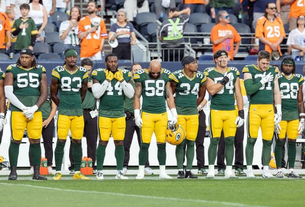 August 22, 2026, Denver, Colorado, USA: Packers sideline stands at attention during the National Anthem in 1st. Half at Empower Field at Mile High Friday evening. Packers beat the Broncos in Pre-Season 33-13. Credit Image: ZUMA Press Wire) Denver USA - ZUMAav4_ 20260822_zaf_av4_022 Copyright: xHectorxAcevedox