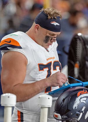August 22, 2026, Denver, Colorado, USA: Broncos LT GARETT BOLLES looks at his plays during the 1st. Half at Empower Field at Mile High Friday evening. Packers beat the Broncos in Pre-Season 33-13. Credit Image: ZUMA Press Wire) Denver USA - ZUMAav4_ 20260822_zaf_av4_054 Copyright: xHectorxAcevedox