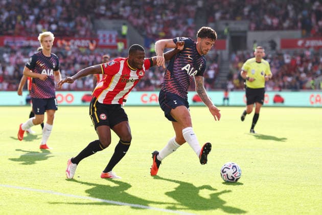 London, England, 22nd August 2026. Dango Ouattara of Brentford and Marcos Senesi of Tottenham Hotspur challenge for the ball during the Brentford vs Tottenham Hotspur Premier League match at Gtech Community Stadium, London. Picture credit should read: Paul Terry Sportimage EDITORIAL USE ONLY. No use with unauthorised audio, video, data, fixture lists, club league logos or live services. Online in-match use limited to 120 images, no video emulation. No use in betting, games or single club league player publications. SPI_048_PT_Brentford_Tottenham SPI-4927-0048