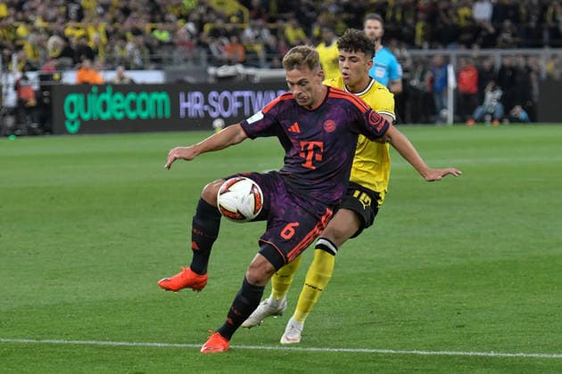 v. li. im Zweikampf Joshua Kimmich (Bayern 6) Samuele Inacio (Dortmund 40) 22.08.2026 ¢ Fussball ¢ Borussia Dortmund vs FC Bayern München ¢ Super Cup, Signal Iduna Park, Dortmund, DFB DFL REGULATIONS PROHIBIT ANY USE OF PHOTOGRAPHS AS IMAGE SEQUENCES AND OR QUASI-VIDEO NRW Germany *** From left: Joshua Kimmich (Bayern 6) and Samuele Inacio (Dortmund 40) in a one-on-one battle, August 22, 2026 ¢ Soccer ¢ Borussia Dortmund vs. FC Bayern Munich ¢ Super Cup, Signal Iduna Park, Dortmund, DFB and DFL regulations prohibit any use of photographs as image sequences and or quasi-video. NRW, Germany Copyright: xpepphotox xSaschaxWeizx pep00321, pep_20260822_hm