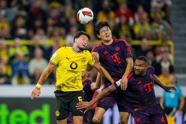 22.08.2026 - Fußball, 2026 2027, Franz-Beckenbauer-Supercup, Borussia Dortmund - FC Bayern München: (L-R) Ramy Bensebaini (Dortmund), Min-jae Kim (München), Jonathan Tah (München) DFB REGULATIONS PROHIBIT ANY USE OF PHOTOGRAPHS AS IMAGE SEQUENCES AND OR QUASI-VIDEO. *** August 22, 2026 Soccer, 2026–2027, Franz Beckenbauer Super Cup, Borussia Dortmund vs. FC Bayern Munich: L R Ramy Bensebaini (Dortmund), Min Jae Kim (Munich), Jonathan Tah (Munich). DFB regulations prohibit any use of photographs as image sequences and or quasi-video.