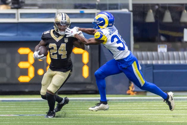 August 22, 2026, Los Angeles, California, United States: New Orleans Saints Running Back Devin Neal (24) runs the ball fighting off pressure from Los Angeles Rams Cornerback Alex Johnson (36) during an NFL, American Football Herren, USA football preseason game, in Inglewood, Calif. Final scores; Rams 34:0 Saints. Los Angeles United States - ZUMAs197 20260822_aaa_s197_383 Copyright: xRingoxChiux