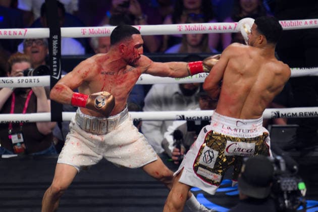Rolando Romero vs Teofimo Lopez in Las Vegas LAS VEGAS, NEVADA - AUG 22: Rolando Rolly Romero (blue glove) and Teofimo Lopez (red glove) exchange punches during their WBA World Welterweight Championship title fight on Saturday night of main event at T-Mobile Arena in Las Vegas, Nevada, United States on August 22, 2026. Tayfun Coskun Anadolu Nevada United States. Editorial use only. Please get in touch for any other usage.  Copyright: x2026xAnadoluxTayfunxCoskunx