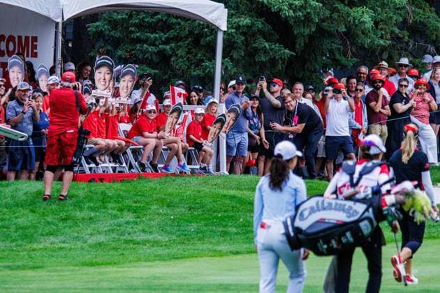 August 22, 2026, Edmonton, Alberta, Canada: Brooke M. Henderson (CAN) walks past her own cheering section called Brooke s Brigade on the second hole of round 3 of the LPGA, Golf Damen CPKC Canadian Women s Open..LPGA CPKC Canada WomenÃ¢â‚¬â ¢s Open leader Mayu Yamashita shot 5 under par to bringing her total to -19, tying the LPGA record after 54 holes. 16-year-old amateur Aphrodite Deng (tied for 6th place) leads all Canadians at 10 under par after shooting 63 (7 under par) in the third round (the low score for the round). Nine players are currently sitting at 10 under par or better heading into the final round. Deng is also one of 4 Canadians under 18 to make the cut, a tournament first. Edmonton Canada - ZUMAs197 20260822_aaa_s197_410 Copyright: xRonxPalmerx