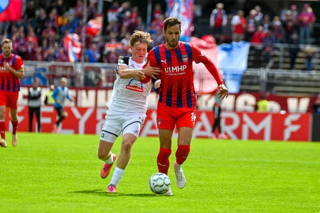 Maximilian Breunig (1. FC Heidenheim, 14) gegen Tom Kanowski (SSV Jeddeloh II, 23) SSV Jeddeloh II vs. 1. FC Heidenheim, Fussball, DFB-Pokal, 1. Runde, Saison 2026 2027, 23.08.2026, SSV Jeddeloh II vs. 1. FC Heidenheim, Fussball, DFB-Pokal, 1. Runde, Saison 2026 2027, 23.08.2026 Oldenburg *** Maximilian Breunig (1 FC Heidenheim), 14 vs. Tom Kanowski (SSV Jeddeloh II), 23 SSV Jeddeloh II vs. 1 FC Heidenheim, Soccer, DFB Cup, 1st Round, 2026–2027 Season, August 23, 2026, SSV Jeddeloh II vs. 1 FC Heidenheim, Soccer, DFB Cup, First Round, 2026–2027 Season, August 23, 2026, Oldenburg Copyright: xEibner-Pressefoto RobertxGertzenx EP_RGN