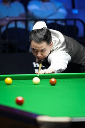 WUHAN, CHINA - AUGUST 23: Xiao Guodong of China plays a shot during his round of 64 match against Wang Xinbo at the 2026 Wuhan Snooker Open on August 23, 2026 in Wuhan, Hubei Province of China. Xiao defeated Wang 5-0 to advance to the round of 32.  Copyright: xTaixChengzhex 111661673565