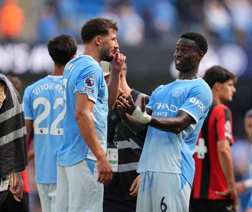 Marc GuÃ hi (6) of Manchester City chats with teammate Ruben Dias after the game Manchester City v Bournemouth, Premier League, Football, Etihad Stadium, Manchester, UK - 23 Aug 2026Manchester Etihad Stadium United Kingdom EDITORIAL USE ONLY No use with unauthorised audio, video, data, fixture lists, club league logos or live services. Online in-match use limited to 120 images, no video emulation. No use in betting, games or single club league player publications.  Copyright: xWiredxPhotos Shutterstockx 17113667cx