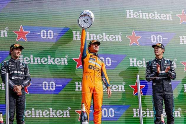 ZANDVOORT - Winner Lando Norris from Great Britain and driver for McLaren Formula 1 Team (M) celebrates his victory, along with Andrea Kimi Antonelli from Italy and driver for Mercedes-AMG PETRONAS F1 Team (L) and George Russell from Great Britain and driver for Mercedes-AMG PETRONAS F1 Team (R) during the podium ceremony after the Formula 1 Heineken Dutch Grand Prix at Circuit Zandvoort on 23 August 2026 in Zandvoort, the Netherlands. MARCEL TER BALS ANP xVIxANPxSportx xMarcelxterxBalsxIVx 566112084 originalFilename: 566112084.jpg