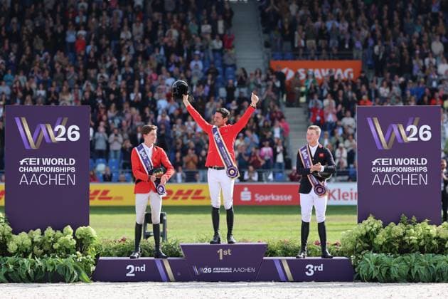 Siegerehrung, Jubel, 1. Platz, Weltmeister Steve Guerdat (SUI, Schweiz) mit Pferd Dynamix de Belheme, 2. Platz Thibeau Spits (BEL, Belgien, Belgium) mit Pferd Impress-K vaunt Kattenheye Z , Harry Charles (GBR, Vereinigtes Königsreich, Großbritannien) mit Pferd LT Holst Freda, Springen, FEI Jumping World Championship, WM, Weltmeisterschaft , FEI Jumping World Championship, Competition Individual Final, Longines-Prize, Longines-Preis, Finale Einzelwertung, Jumping , AACHEN - FEI World Championships 2026, Weltfest des Pferdesports, Reitsport Weltmeisterschaft 2026, Aachen 2026, Welcome Home 2026, Aachener Soers, 11. bis 23. August 2026, Reitsport, 23.08.2026, Aachen Aachener Soers Deutschland *** Awards Ceremony, Cheering, 1st place: World Champion Steve Guerdat (SUI), Switzerland, riding Dynamix de Belheme; 2nd place: Thibeau Spits (BEL), Belgium, riding Impress K vaunt Kattenheye Z; Harry Charles (GBR), United Kingdom, riding LT Holst Freda; Show Jumping, FEI Jumping World Championship, FEI Jumping World Championship, Individual Final, Longines Prize, Longines Prize, Individual Final, Show Jumping, AACHEN FEI World Championships 2026, World Festival of Equestrian Sports, 2026 Equestrian World Championships, Aachen 2026, Welcome Home 2026, Aachen Soers, August 11–23, 2026, Equestrian Sports, August 23, 2026, Aachen Soers, Germany