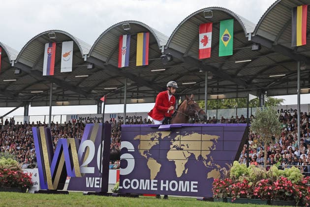 Richard Vogel (GER, Deutschland) mit Pferd Unites Touch S, aktueller Europameister und Sieger des Rolex Grand Prix von Aachen 2026 (CHIO Aachen) scheitert an der WM-Mauer, Springfehler , Springen, FEI Jumping World Championship, WM, Weltmeisterschaft , FEI Jumping World Championship, Competition Individual Final, Longines-Prize, Longines-Preis, Finale Einzelwertung, Jumping , AACHEN - FEI World Championships 2026, Weltfest des Pferdesports, Reitsport Weltmeisterschaft 2026, Aachen 2026, Welcome Home 2026, Aachener Soers, 11. bis 23. August 2026, Reitsport, 23.08.2026, Aachen Aachener Soers Deutschland *** Richard Vogel (GER, Germany), riding Unites Touch S, the reigning European champion and winner of the 2026 Rolex Grand Prix at CHIO Aachen, fails to clear the World Championship wall; jumping fault; show jumping; FEI Jumping World Championship; FEI Jumping World Championship, Individual Final, Longines Prize, Jumping, AACHEN FEI World Championships 2026, World Equestrian Festival, 2026 World Equestrian Games, Aachen 2026, Welcome Home 2026, Aachen Soers, August 11–23, 2026, Equestrian Sports, August 23, 2026, Aachen Soers, Germany