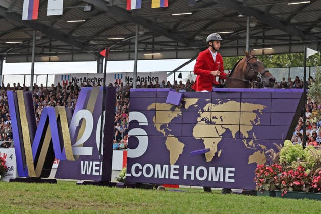 Richard Vogel (GER, Deutschland) mit Pferd Unites Touch S, aktueller Europameister und Sieger des Rolex Grand Prix von Aachen 2026 (CHIO Aachen) scheitert an der WM-Mauer, Springfehler , Springen, FEI Jumping World Championship, WM, Weltmeisterschaft , FEI Jumping World Championship, Competition Individual Final, Longines-Prize, Longines-Preis, Finale Einzelwertung, Jumping , AACHEN - FEI World Championships 2026, Weltfest des Pferdesports, Reitsport Weltmeisterschaft 2026, Aachen 2026, Welcome Home 2026, Aachener Soers, 11. bis 23. August 2026, Reitsport, 23.08.2026, Aachen Aachener Soers Deutschland *** Richard Vogel (GER, Germany), riding Unites Touch S, the reigning European champion and winner of the 2026 Rolex Grand Prix at CHIO Aachen, fails to clear the World Championship wall; jumping fault; show jumping; FEI Jumping World Championship; FEI Jumping World Championship, Individual Final, Longines Prize, Jumping, AACHEN FEI World Championships 2026, World Equestrian Festival, 2026 World Equestrian Games, Aachen 2026, Welcome Home 2026, Aachen Soers, August 11–23, 2026, Equestrian Sports, August 23, 2026, Aachen Soers, Germany