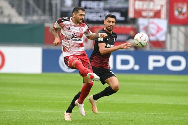 Matthias ZIMMERMANN (D) gegen Vincenzo GRIFO (FR) Aktion, Zweikampf, Fussball DFB Pokal, 1. Hauptrunde, Fortuna Duesseldorf (D) - SC Freiburg (FR) am 23.08.2026 in der Merkur Spiel Arena Duesseldorf Deutschland. DFL DFB regulations prohibit any use of photographs as image sequences and or quasi-video Â *** Matthias ZIMMERMANN (D) vs. Vincenzo GRIFO (FR) Action, Tackle, Soccer, DFB Cup, 1st Round, Fortuna Düsseldorf (D) vs. SC Freiburg (FR) on August 23, 2026, at the Merkur Spiel Arena in Düsseldorf, Germany. DFL and DFB regulations prohibit any use of photographs as image sequences and or quasi-video.