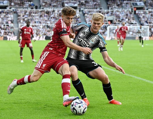 Newcastle Upon Tyne, England, 23rd August 2026. Victor Munoz of Liverpool (l) challenged by Lewis Hall of Newcastle United (r) during the Newcastle United vs Liverpool Premier League match at St. James Park, Newcastle Upon Tyne. Picture credit should read: Anna Gowthorpe Sportimage EDITORIAL USE ONLY. No use with unauthorised audio, video, data, fixture lists, club league logos or live services. Online in-match use limited to 120 images, no video emulation. No use in betting, games or single club league player publications. SPI_049_AG_Newcastle_Liverpool SPI-4932-0048