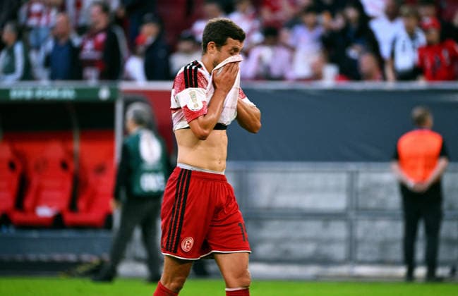 Düsseldorf, Germany, DFB Cup, 1. Round, Merkur-Spiel-Arena Düsseldorf, Fortuna Düsseldorf vs SC Freiburg 1:5; Tim Oberdorf (F95) disappointed after the match. Disappointment, Frustration, Action. *** Düsseldorf, Germany, DFB Cup, 1st Round, Merkur Spiel Arena Düsseldorf, Fortuna Düsseldorf vs. SC Freiburg 1-5; Tim Oberdorf (F95) disappointed after the match; Disappointment, Frustration, Action