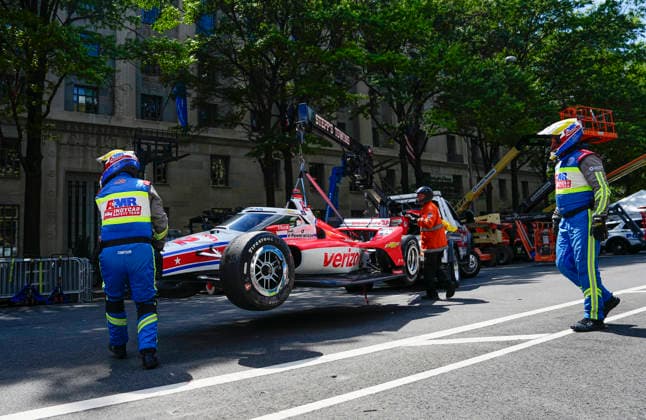 The car of Team Penske driver David Malukas (12) is taken off the track after Malukas crashed on lap 36 of the Freedom 250 Grand Prix IndyCar, Indy Car, IRL, USA Series race on the National Mall in Washington, DC on Sunday, August 23, 2026.  WAP20260823846 BONNIExCASH