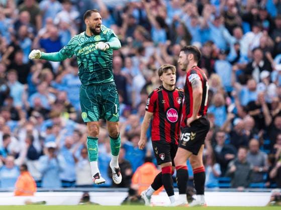 Gianluigi Donnarumma of Manchester City celebrates his teams 2nd goal after VAR review in front of Ben Gannon-Doak (middle) and Adam Smith (c) (right) Manchester City v Bournemouth, Premier League, Football, Etihad Stadium, Manchester, UK - 23 Aug 2026Manchester Etihad Stadium United Kingdom EDITORIAL USE ONLY No use with unauthorised audio, video, data, fixture lists, club league logos or live services. Online in-match use limited to 120 images, no video emulation. No use in betting, games or single club league player publications.  Copyright: xWiredxPhotos Shutterstockx 17113667ee