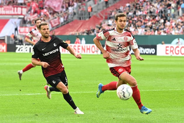 Tim OBERDORF (D) gegen Lucas HOELER (Höler, FR) Aktion, Zweikampf, Fussball DFB Pokal, 1. Hauptrunde, Fortuna Duesseldorf (D) - SC Freiburg (FR) 1-5 am 23.08.2026 in der Merkur Spiel Arena Duesseldorf Deutschland. DFL DFB regulations prohibit any use of photographs as image sequences and or quasi-video Â *** Tim OBERDORF (D) vs. Lucas HOELER (Höler), FR Action, Tackle, Soccer, DFB Cup, 1st Round, Fortuna Düsseldorf D vs. SC Freiburg FR 1:5 on August 23, 2026, at the Merkur Spiel Arena in Düsseldorf, Germany. DFL and DFB regulations prohibit any use of photographs as image sequences and or quasi-video.