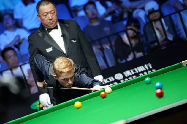 WUHAN, CHINA - AUGUST 24: Artemijs Zizins of Latvia plays a shot in the second round match against Wu Yize of China on day 2 of Wuhan Open 2026 at the Optics Valley Gymnasium of Huazhong University of Science and Technology on August 24, 2026 in Wuhan, Hubei Province of China.  Copyright: xTaixChengzhex 111661853305