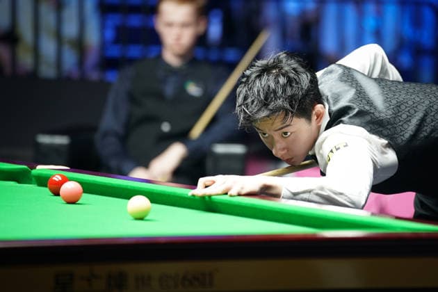 WUHAN, CHINA - AUGUST 24: Wu Yize of China plays a shot in the second round match against Artemijs Zizins of Latvia on day 2 of Wuhan Open 2026 at the Optics Valley Gymnasium of Huazhong University of Science and Technology on August 24, 2026 in Wuhan, Hubei Province of China.  Copyright: xTaixChengzhex 111661853325