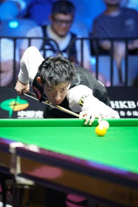 WUHAN, CHINA - AUGUST 24: Wu Yize of China plays a shot in the second round match against Artemijs Zizins of Latvia on day 2 of Wuhan Open 2026 at the Optics Valley Gymnasium of Huazhong University of Science and Technology on August 24, 2026 in Wuhan, Hubei Province of China.  Copyright: xTaixChengzhex 111661853311